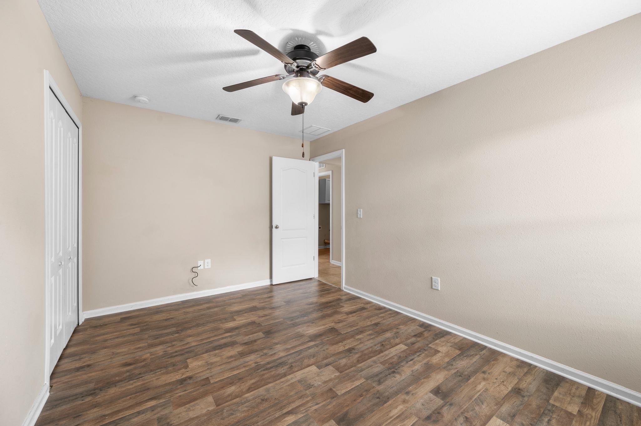 509 Deer Crossing Road St. Augustine, FL 32086 - Photo 32 of 54 wooden floor in an empty room