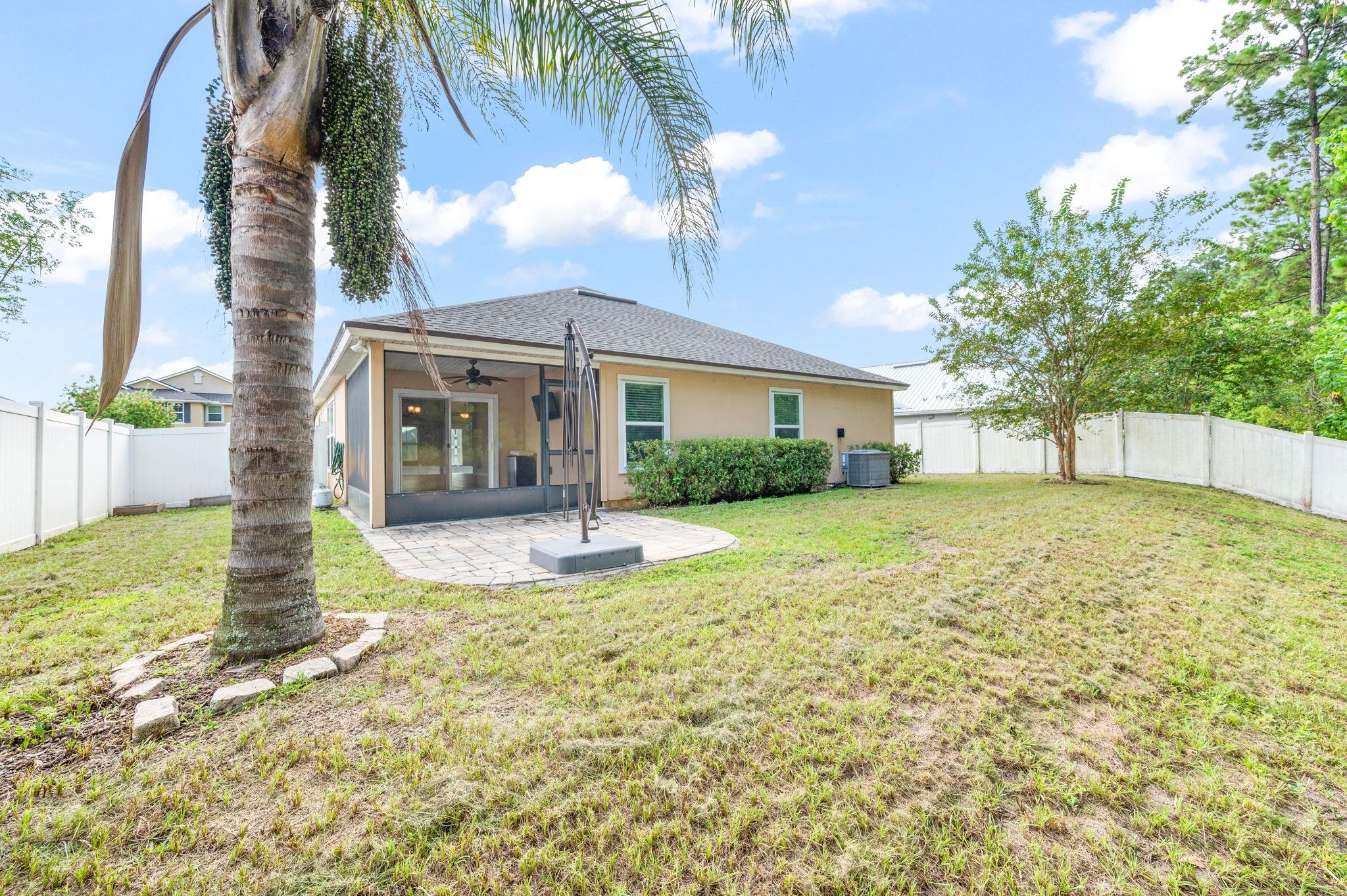 509 Deer Crossing Road St. Augustine, FL 32086 - Photo 37 of 54 a view of a house with backyard and sitting area