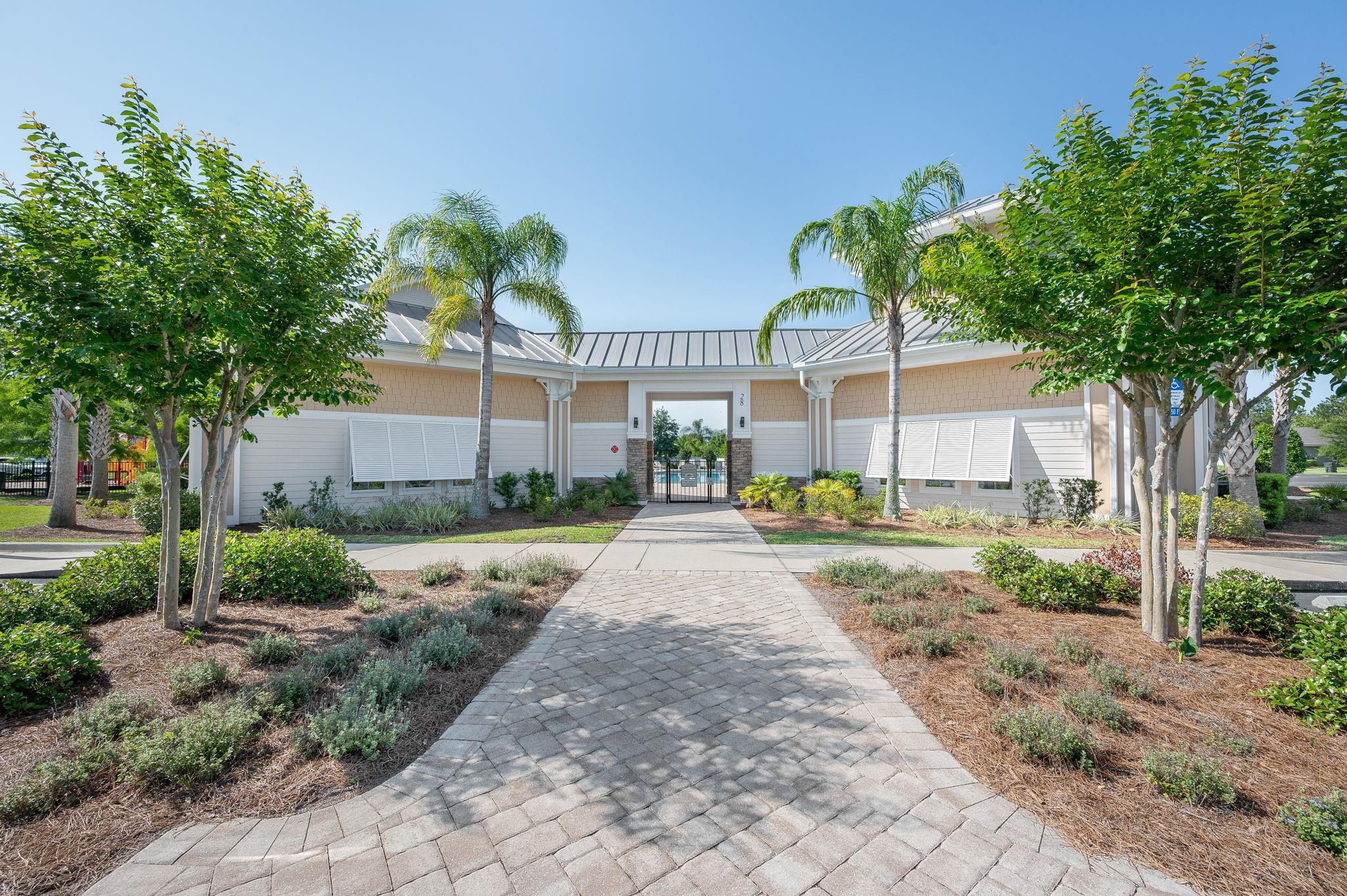 509 Deer Crossing Road St. Augustine, FL 32086 - Photo 44 of 54 a view of a yard with plants and a large tree