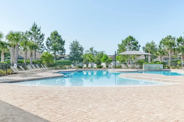 a view of a terrace space with a lake view