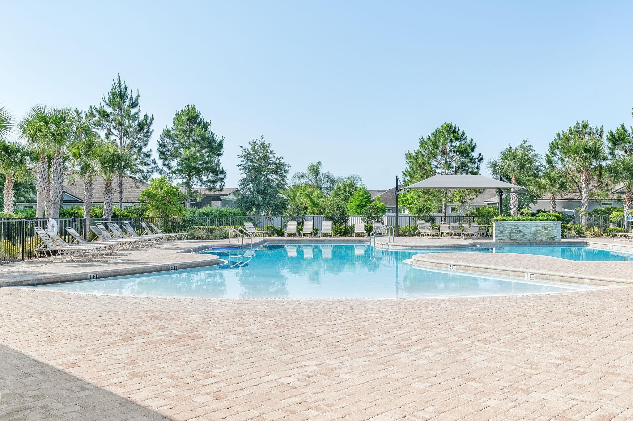 509 Deer Crossing Road St. Augustine, FL 32086 - Photo 45 of 54 a view of a swimming pool and a yard