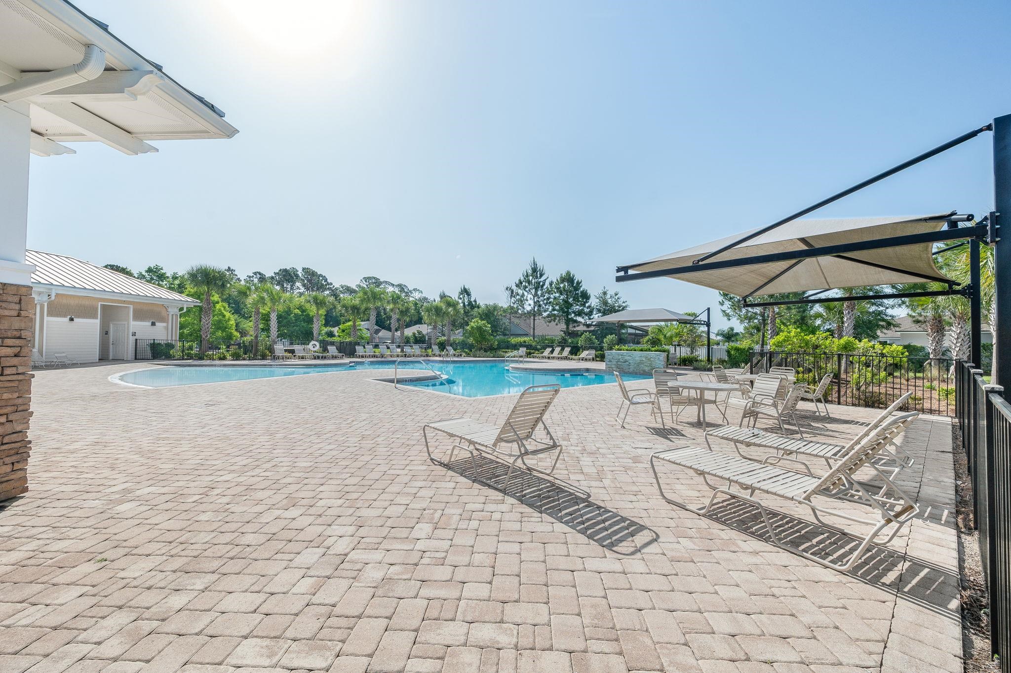 509 Deer Crossing Road St. Augustine, FL 32086 - Photo 46 of 54 a view of swimming pool with outdoor seating and plants