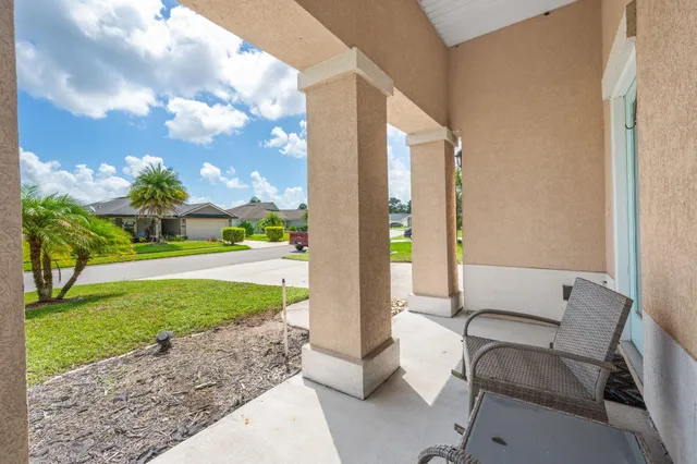 a view of backyard with outdoor seating