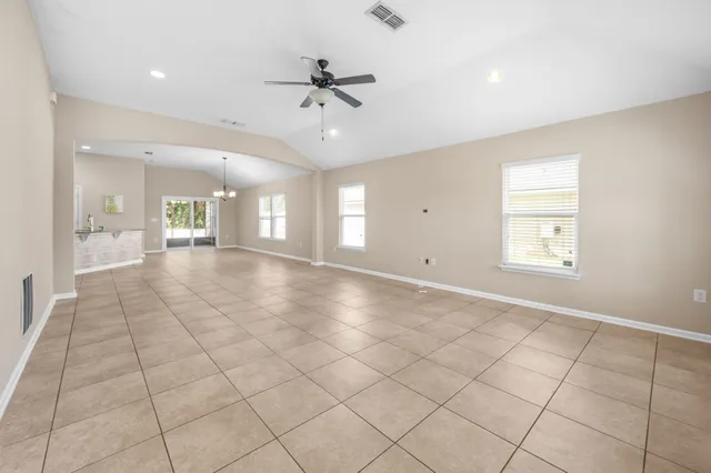 a view of an empty room and a window