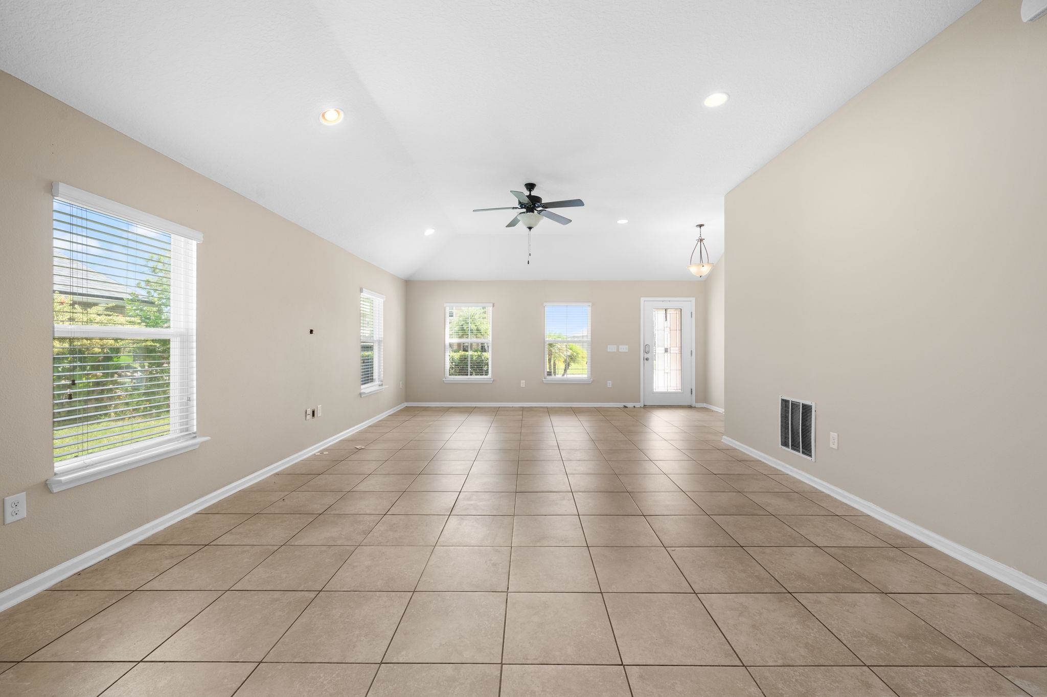 509 Deer Crossing Road St. Augustine, FL 32086 - Photo 9 of 54 a view of an empty room with a window