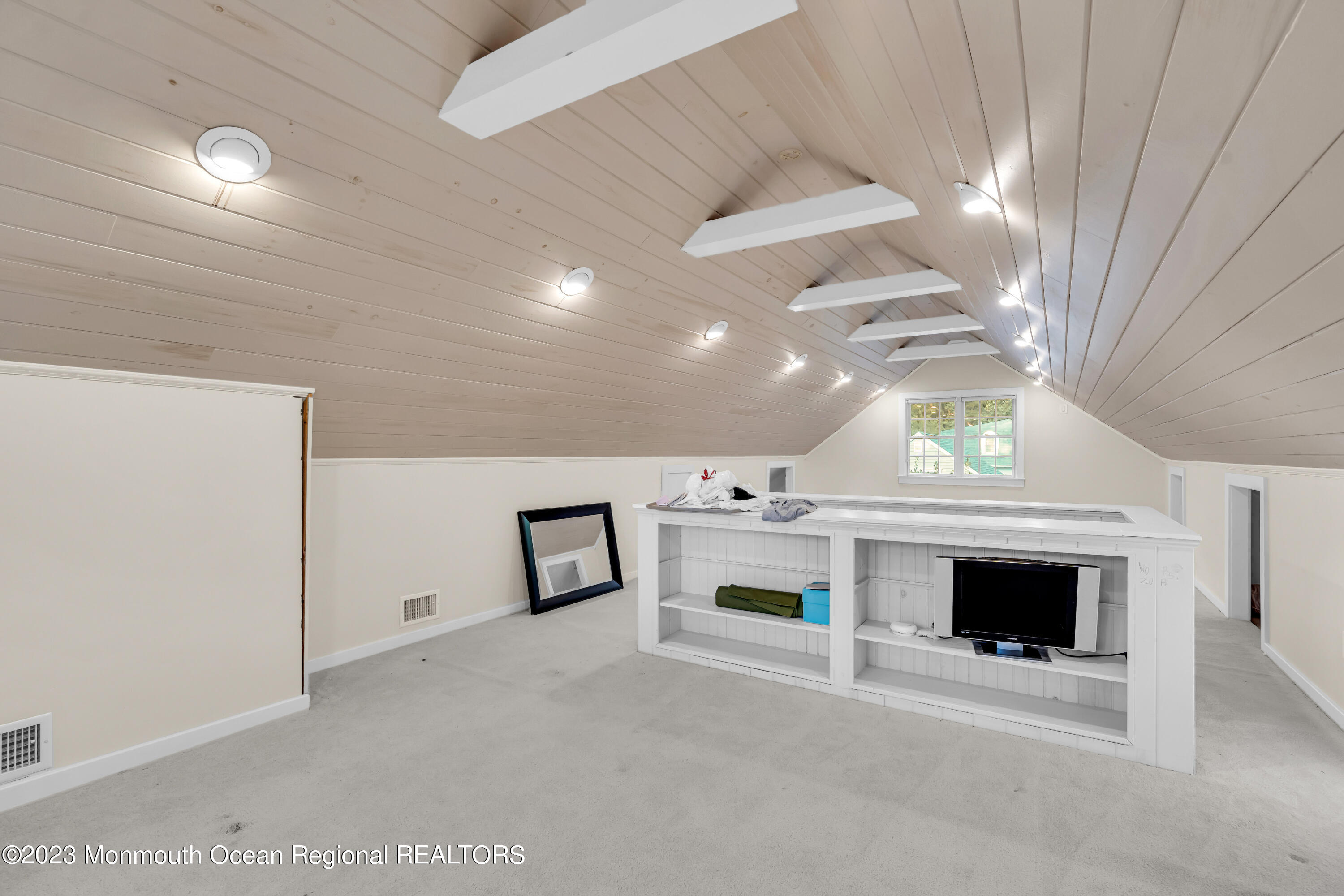 915 Birch Drive Brielle, NJ 08730 - Photo 37 of 49 wooden floor with fireplace and window