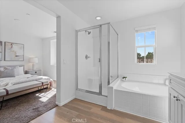 a bathroom with a tub and a shower