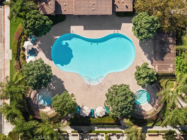 an aerial view of a house with yard swimming pool and outdoor seating