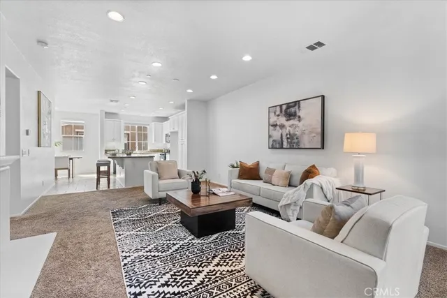 a living room with furniture and a couch