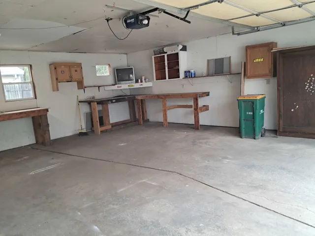 a living room with stainless steel appliances kitchen island granite countertop furniture and a kitchen view