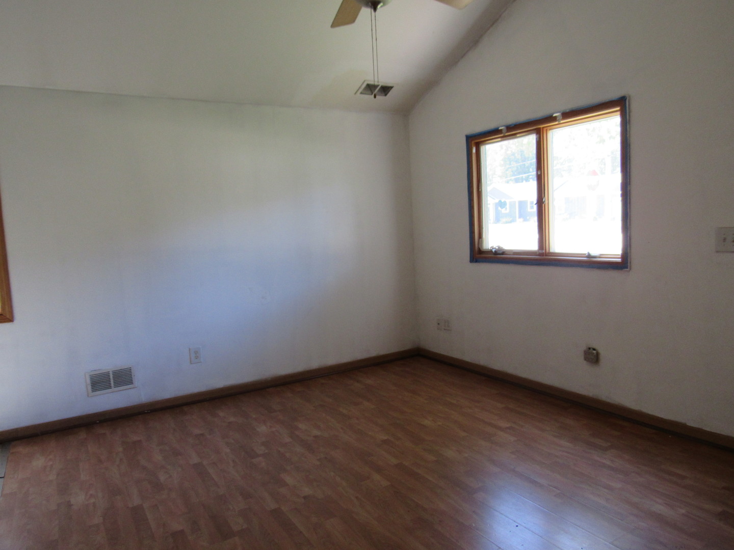 303 North Division Street Braidwood, IL 60408 - Photo 6 of 20 an empty room with wooden floor and windows