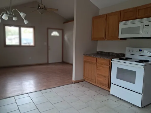 a kitchen with a stove and a microwave