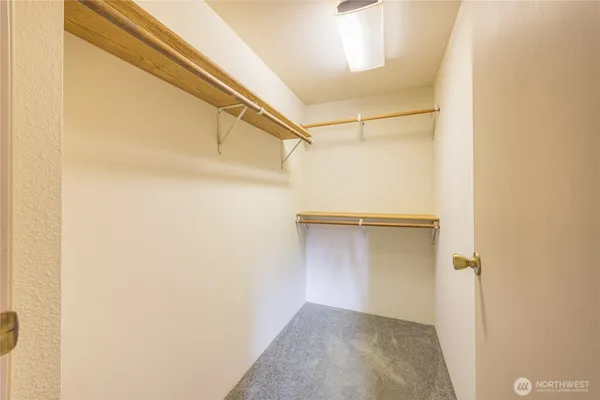 a view of an empty walk in closet