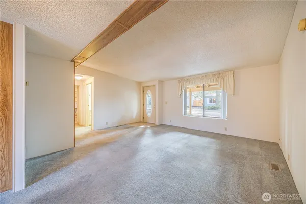 a view of an empty room with a window