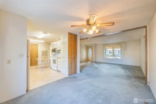 a view of a big room with closet and windows