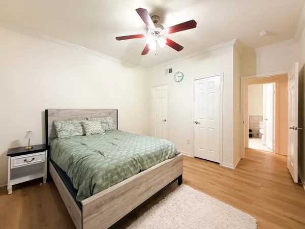 a white toilet and tub sitting next to a bathroom sink