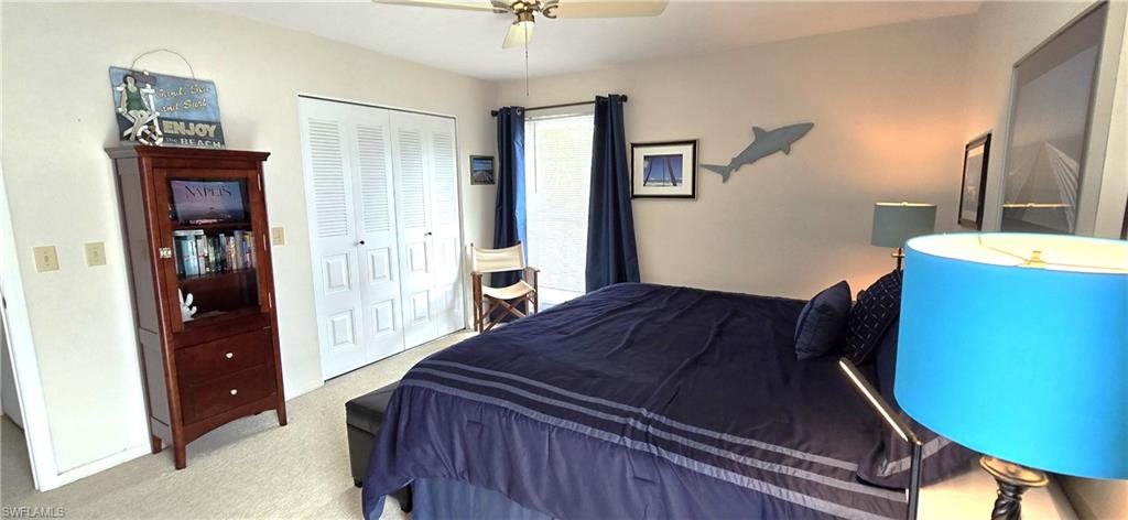 69 Georgetown Boulevard, Unit 69 Naples, FL 34112 - Photo 12 of 21 a bedroom with a bed and a dresser