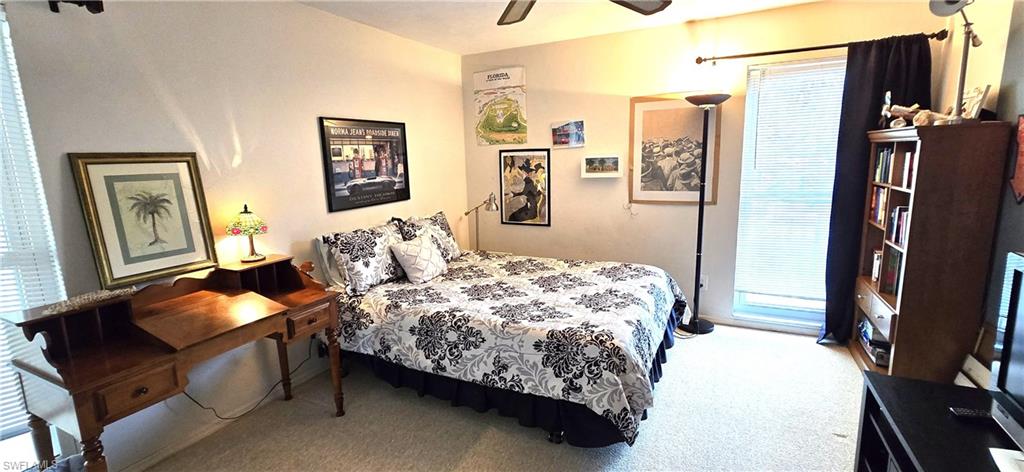 69 Georgetown Boulevard, Unit 69 Naples, FL 34112 - Photo 14 of 21 a bedroom with bed and a window