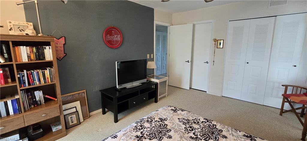 69 Georgetown Boulevard, Unit 69 Naples, FL 34112 - Photo 15 of 21 a view of a livingroom with furniture and workspace
