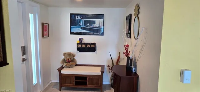 a room with table and a potted plant