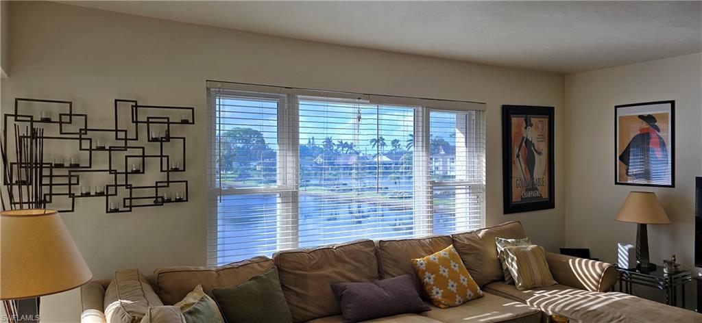 69 Georgetown Boulevard, Unit 69 Naples, FL 34112 - Photo 6 of 21 a living room with furniture and a window