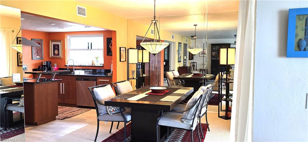 69 Georgetown Boulevard, Unit 69 Naples, FL 34112 - Photo 7 of 21 a view of a dining room with furniture