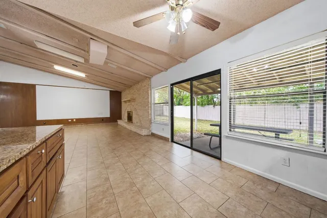 a view of a kitchen with a sink and cabinets
