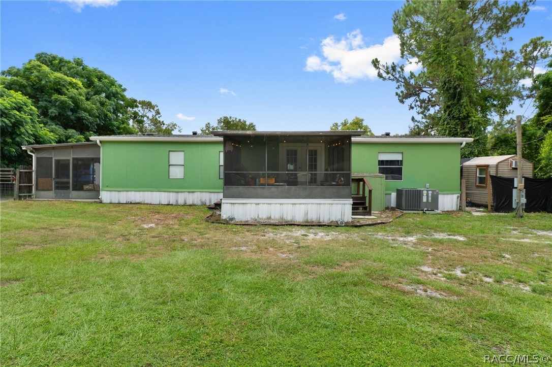 7927 West Cyprian Court Homosassa, FL 34448 - Photo 36 of 40 a view of a house with backyard and a tree