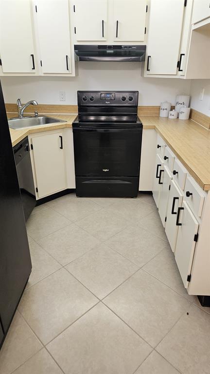 721 Sunny Pine Way, Unit G2 Greenacres, FL 33415 - Photo 1 of 34 a kitchen with granite countertop a stove and a sink