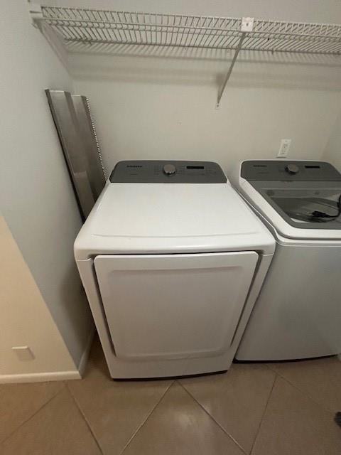 721 Sunny Pine Way, Unit G2 Greenacres, FL 33415 - Photo 12 of 34 a utility room with dryer and washer