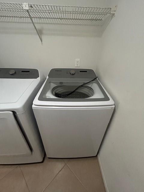 721 Sunny Pine Way, Unit G2 Greenacres, FL 33415 - Photo 13 of 34 a utility room with dryer and washer