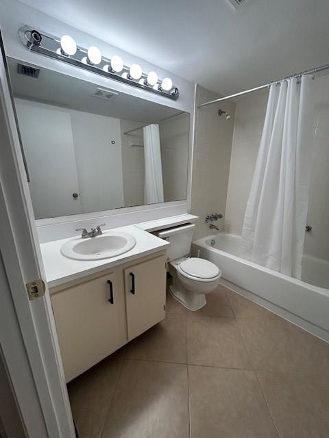 721 Sunny Pine Way, Unit G2 Greenacres, FL 33415 - Photo 15 of 34 a spacious bathroom with a double vanity sink toilet and a mirror