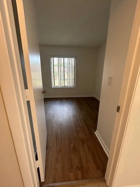 721 Sunny Pine Way, Unit G2 Greenacres, FL 33415 - Photo 18 of 34 a view of a hallway in a house with wooden floor