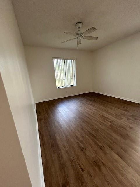 721 Sunny Pine Way, Unit G2 Greenacres, FL 33415 - Photo 23 of 34 wooden floor in an empty room with a window