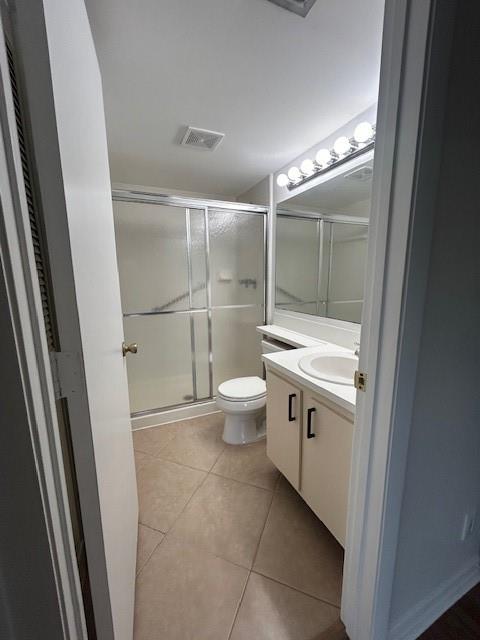 721 Sunny Pine Way, Unit G2 Greenacres, FL 33415 - Photo 26 of 34 a bathroom with a granite countertop sink toilet and shower