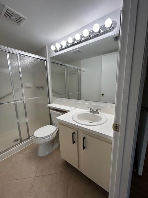 721 Sunny Pine Way, Unit G2 Greenacres, FL 33415 - Photo 27 of 34 a bathroom with a sink a toilet and shower