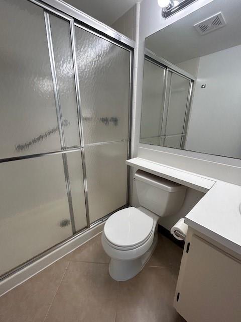 721 Sunny Pine Way, Unit G2 Greenacres, FL 33415 - Photo 28 of 34 a white toilet sitting next to a shower
