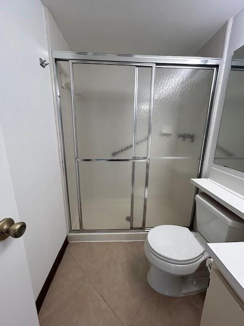 721 Sunny Pine Way, Unit G2 Greenacres, FL 33415 - Photo 29 of 34 a white toilet sitting next to a shower