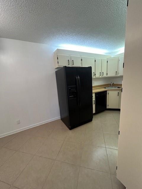 721 Sunny Pine Way, Unit G2 Greenacres, FL 33415 - Photo 3 of 34 a kitchen with a refrigerator and cabinets