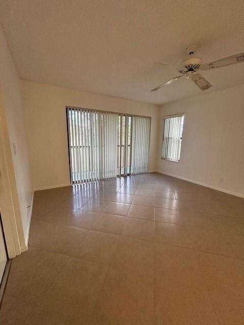 721 Sunny Pine Way, Unit G2 Greenacres, FL 33415 - Photo 9 of 34 wooden floor in an empty room with a window