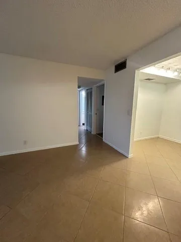 a view of a storage & utility room with a sink