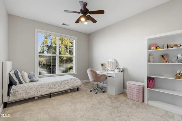 a room with a bed and furniture