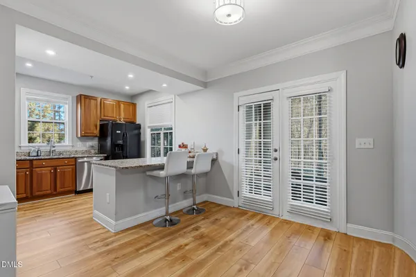 a kitchen with stainless steel appliances a refrigerator and a stove top oven