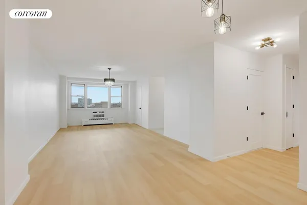 a view of a room with wooden floor