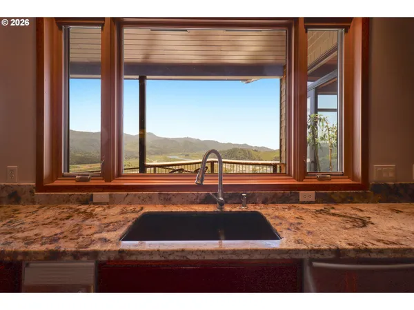 a kitchen with a stove and a shower