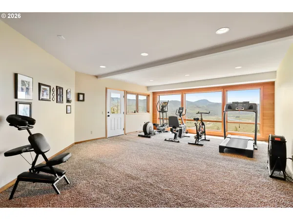 a room with furniture and gym equipment