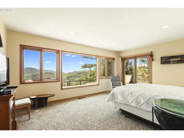 a view of a room that has a large window