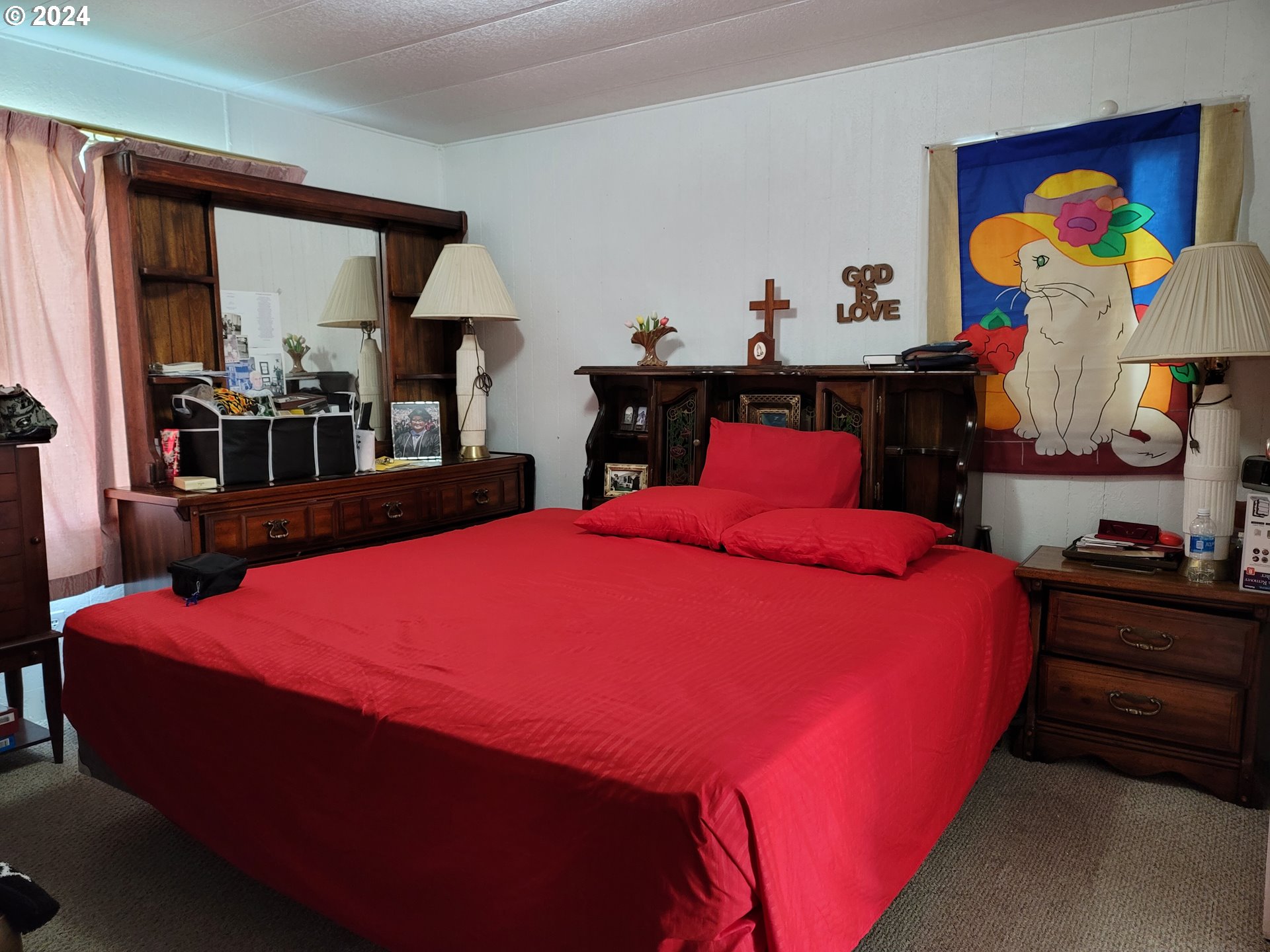 449 Evergreen Ridge Road Riddle, OR 97469 - Photo 11 of 21 a large bed sitting in a bedroom next to a window