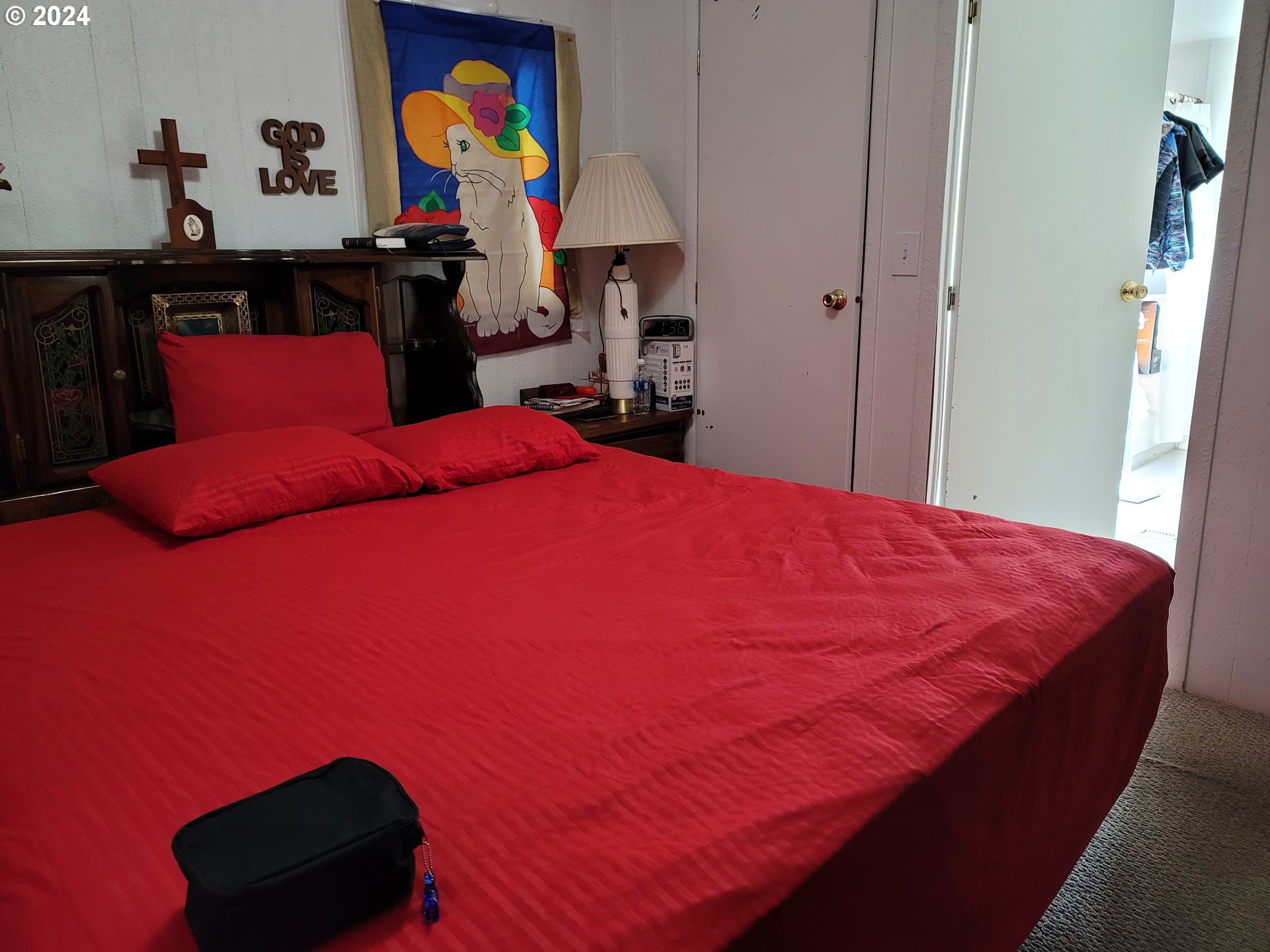 449 Evergreen Ridge Road Riddle, OR 97469 - Photo 12 of 21 a blue bed sitting in a bedroom next to a window