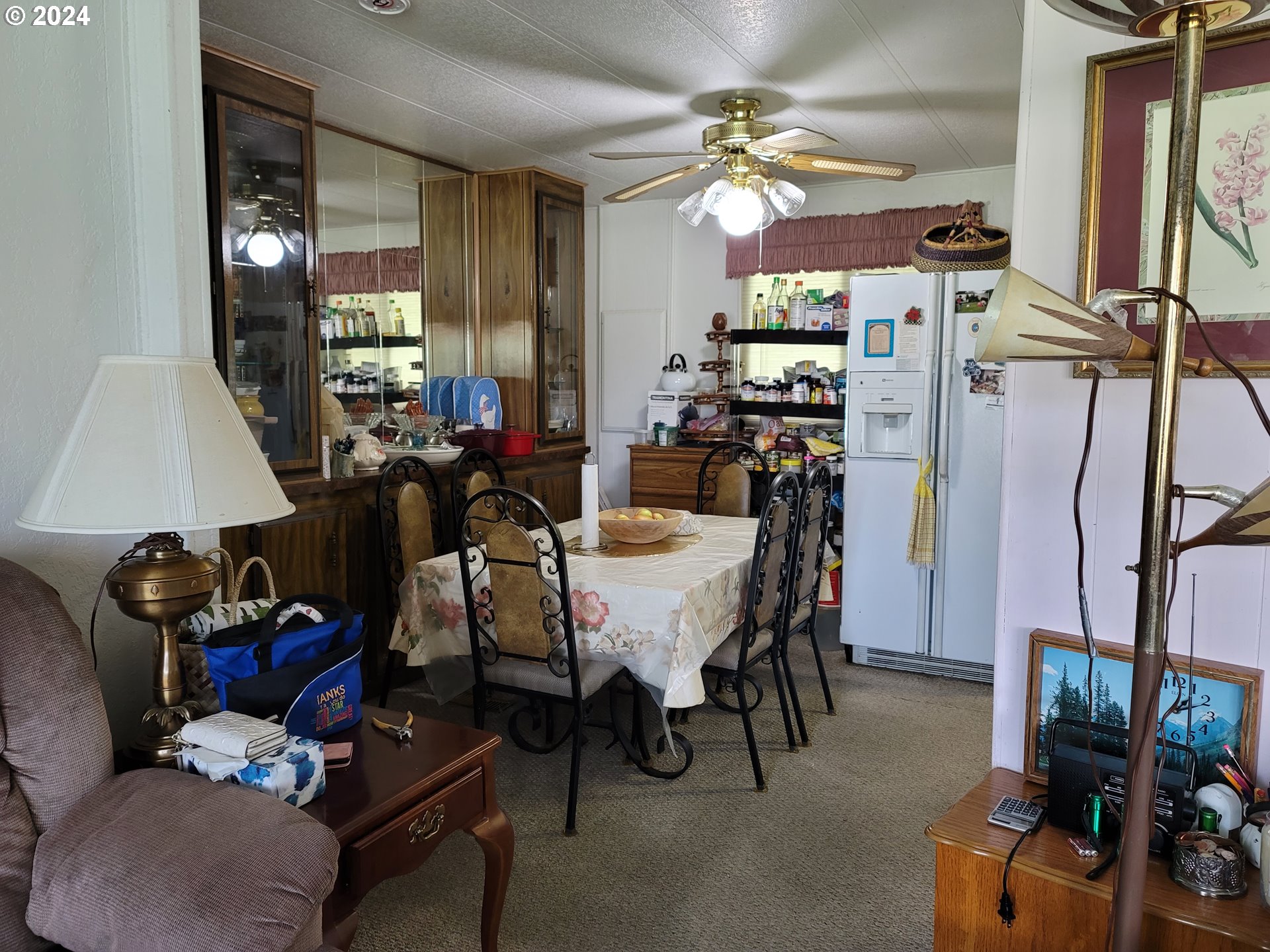 449 Evergreen Ridge Road Riddle, OR 97469 - Photo 8 of 21 a view of a dining room with furniture and chandelier
